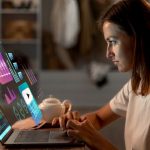 Employee interacting with an AI-powered, scenario-based training module on a laptop. Represents immersive learning without VR using accessible, screen-friendly digital content.